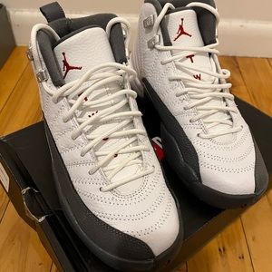 Jordan 12s The color way is Grey and white